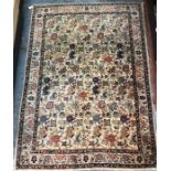 An old Persian Kashan carpet, the floral design on camel ground