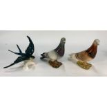 Two Beswick pigeons and a model of a swallow