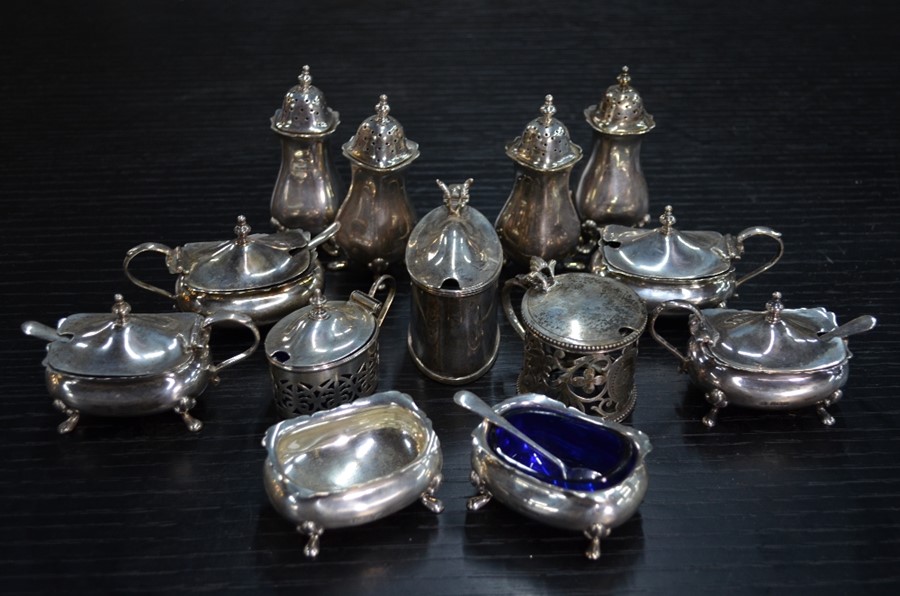 A collection of silver condiments