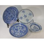 Three Chinese blue and white chargers and a blue and white bowl
