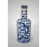 A small Chinese blue and white bottle vase with dragons bears Kangxi mark