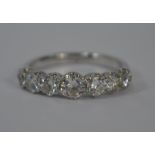 A seven stone diamond half eternity ring