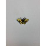 A small Norwegian silver and enamel pin brooch in the form of a butterfly