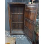 An antique joint oak cupboard in the Flemish style