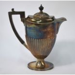 Edwardian oval silver half-reeded hot water jug