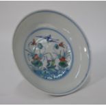 A Chinese lotus pond and birds doucai saucer dish