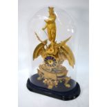 A French gilt mantel clock surmounted by an allegorical representation of St Margaret and the Dragon