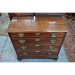 An 18th century Georgian inlaid mahogany chest of four long graduated cock-beaded drawers