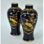 A pair of Chinese export underglaze blue vases, manner or James Giles