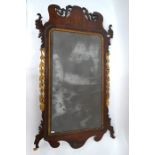 An 18th century mahogany fret cut and parcel gilt adorned pier glass