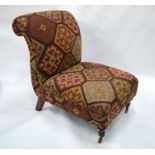 A kelim upholstered scroll back chair