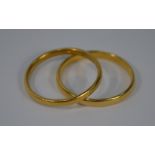 Two 22ct yellow gold wedding bands