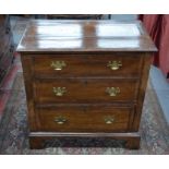 A 19th century feather-banded walnut chest of three long drawers