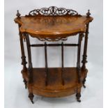 A Victorian burr walnut two tier what-not of serpentine form