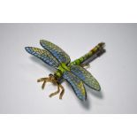 An en tremblant dragonfly brooch with plique a jour enamel decoration