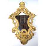 A George III carved giltwood cartouche wall mirror
