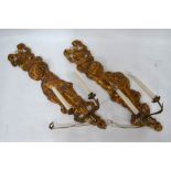 A pair of carved giltwood girandoles