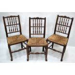 Set of four 18th/19th century oak spindle back rush seat side chairs