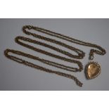 A Victorian fancy heart-shaped locket and chain