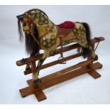 A small traditional painted wood rocking horse