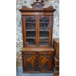 An Edwardian glazed red walnut Art Nouveau influenced chiffonier bookcase