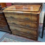 A 19th century continental walnut chest of four long graduated drawers