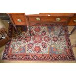 An antique Persian Tabriz rug