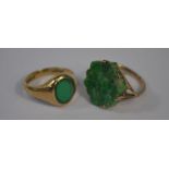 A carved green jade ring and green stone signet ring
