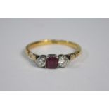 A three stone ruby and diamond ring