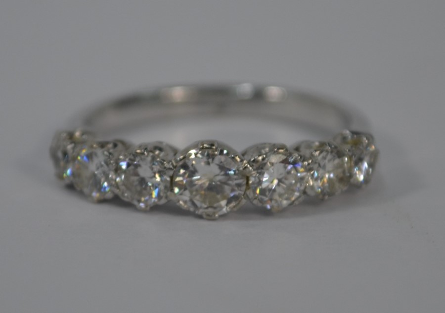 A seven stone diamond half eternity ring