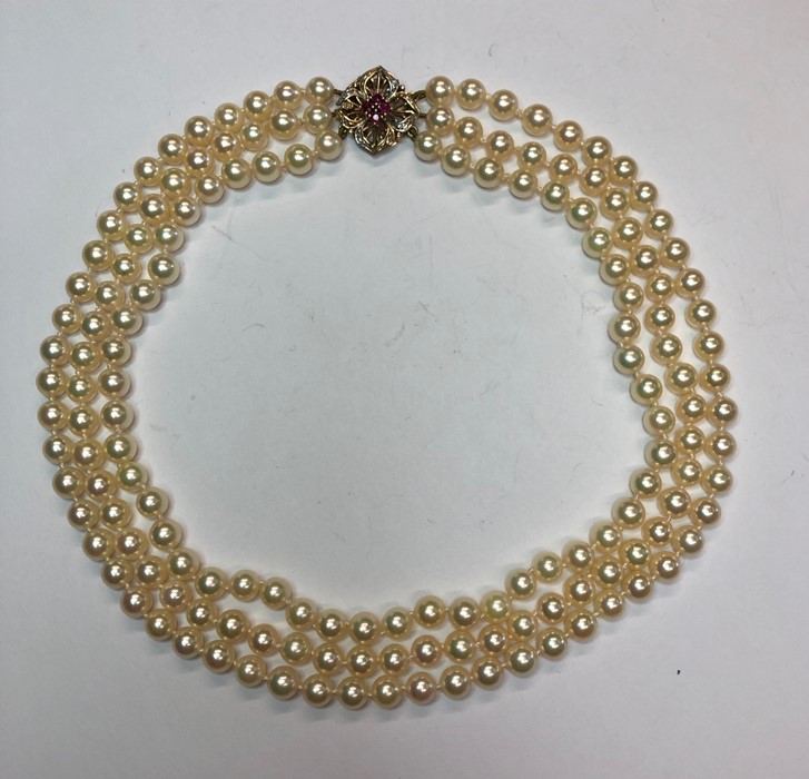 A three-row uniform cultured pearl choker necklace