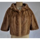 A shadowed taupe mink eve jacket