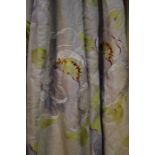 A pair of natural linen ground curtains