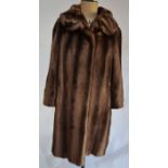 A vintage Astraka faux fur shadowed light brown coat