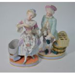 A pair of Meissen porcelain posy figures