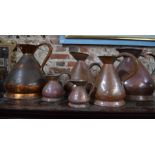 Six graduated Georgian copper measures / jugs / pitchers