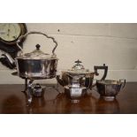 An epns three piece bachelor teaset, to/w an electroplated kettle on burner stand (4)