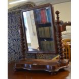A 19th century mahogany framed dressing table mirror with barley twist supports and serpentine