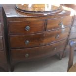 A Victorian mahogany bowfront chest of two short over two long drawers with brass handles and shaped
