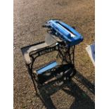 An old Singer branded cast iron treadle base to/w a table top mangle (2)