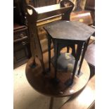 A circular teak table to/w an Arts & Crafts octagonal occasional table and a bookrack (3)