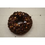 A Christmas wreath with nuts and fir cones by Pierson of Montana
