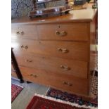 A large mahogany chest of two short over three long drawers raised on bracket feet