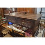 A Portuguese hardwood rectangular coffee table with a deep frieze fitted with two drawers