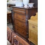 A large Victorian mahogany chest with a cushion moulded drawer over three standard drawers between