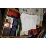 A box containing a listed collection of cased and loose mostly British coinage include Crowns and