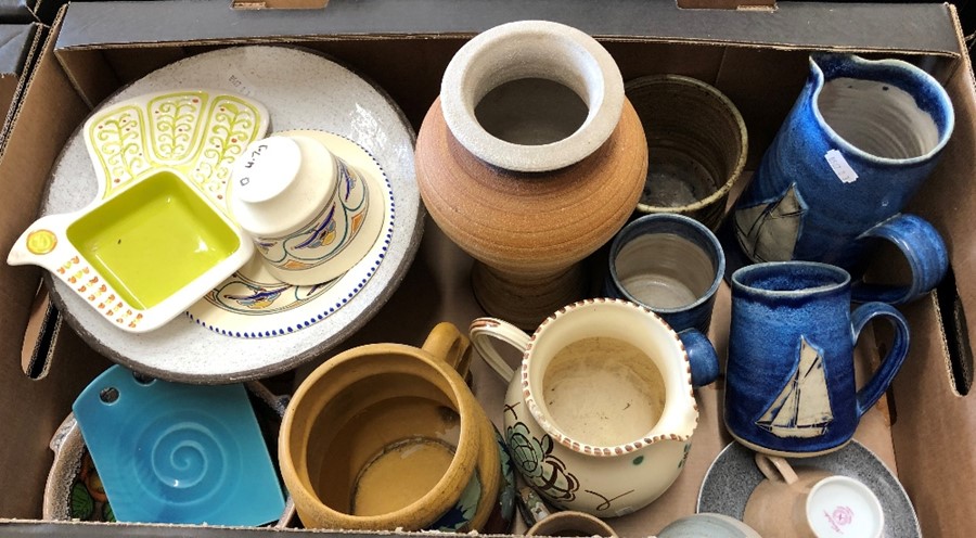 A box of mainly studio pottery wares including a Honiton jug and Poole Pottery teacup and saucer