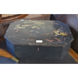 An antique Japanese black lacquered casket with polychrome painted decoration, fisherman on a