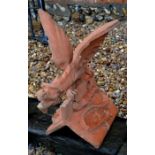 A large terracotta composite dragon ridge tile