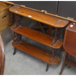 A Victorian mahogany three-tier bookshelf with fret cut supports